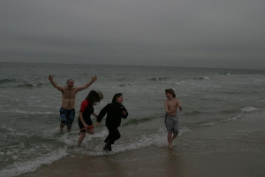 Faithful retrieve the cross thrown in by Fr. Martin